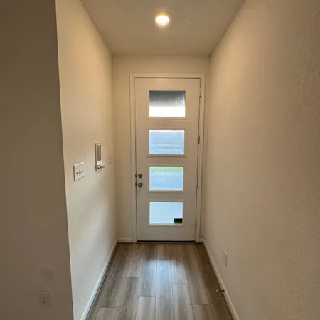 wooden floor in a empty room with a mirror