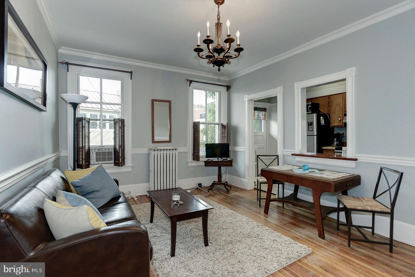 408 6th Street Southeast, Unit 3 Washington, DC 20003 - Photo 2 of 13 a living room with furniture and a chandelier