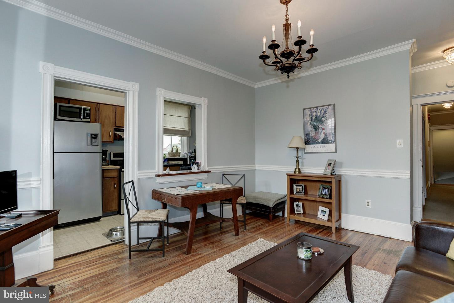 408 6th Street Southeast, Unit 3 Washington, DC 20003 - Photo 4 of 13 a view of a workspace with furniture and a livingroom