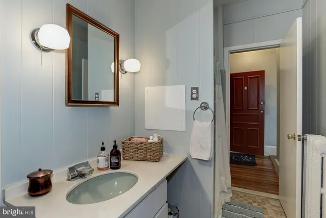 a bathroom with a sink and a mirror