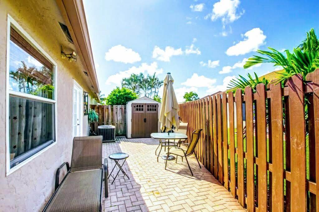 9709 Sunny Isle Circle Boca Raton, FL 33428 - Photo 14 of 21 a view of two chairs in balcony
