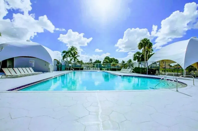 a view of a lake with a swimming pool