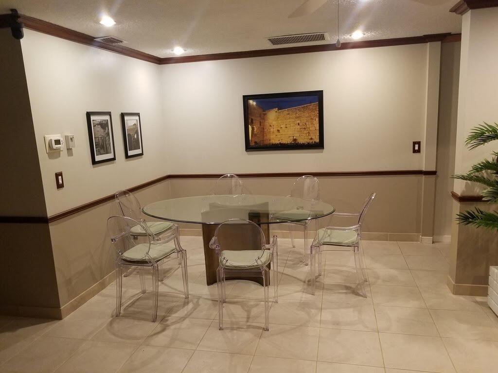 9709 Sunny Isle Circle Boca Raton, FL 33428 - Photo 5 of 21 a living room with couch chairs and a refrigerator