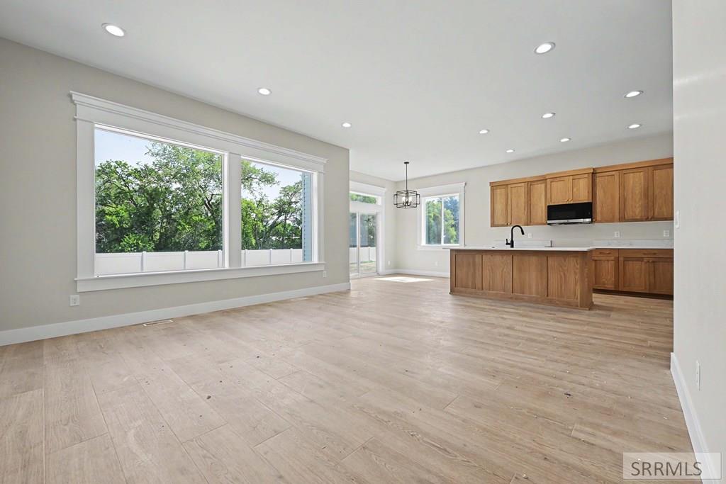 448 Willowbend Rigby, ID 83442 - Photo 2 of 17 Great Room to Kitchen/Dining Area