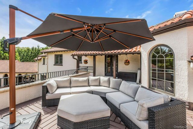 a outdoor space with patio the couches and a umbrella