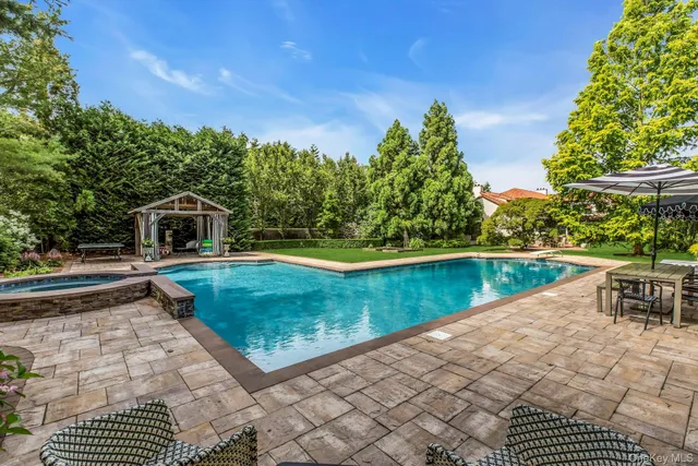 a view of a swimming pool with a patio