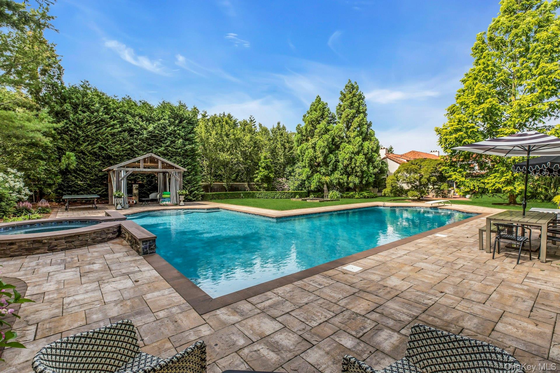 259 Lakeview Avenue West Brightwaters, NY 11718 - Photo 20 of 49 a view of a swimming pool with a patio