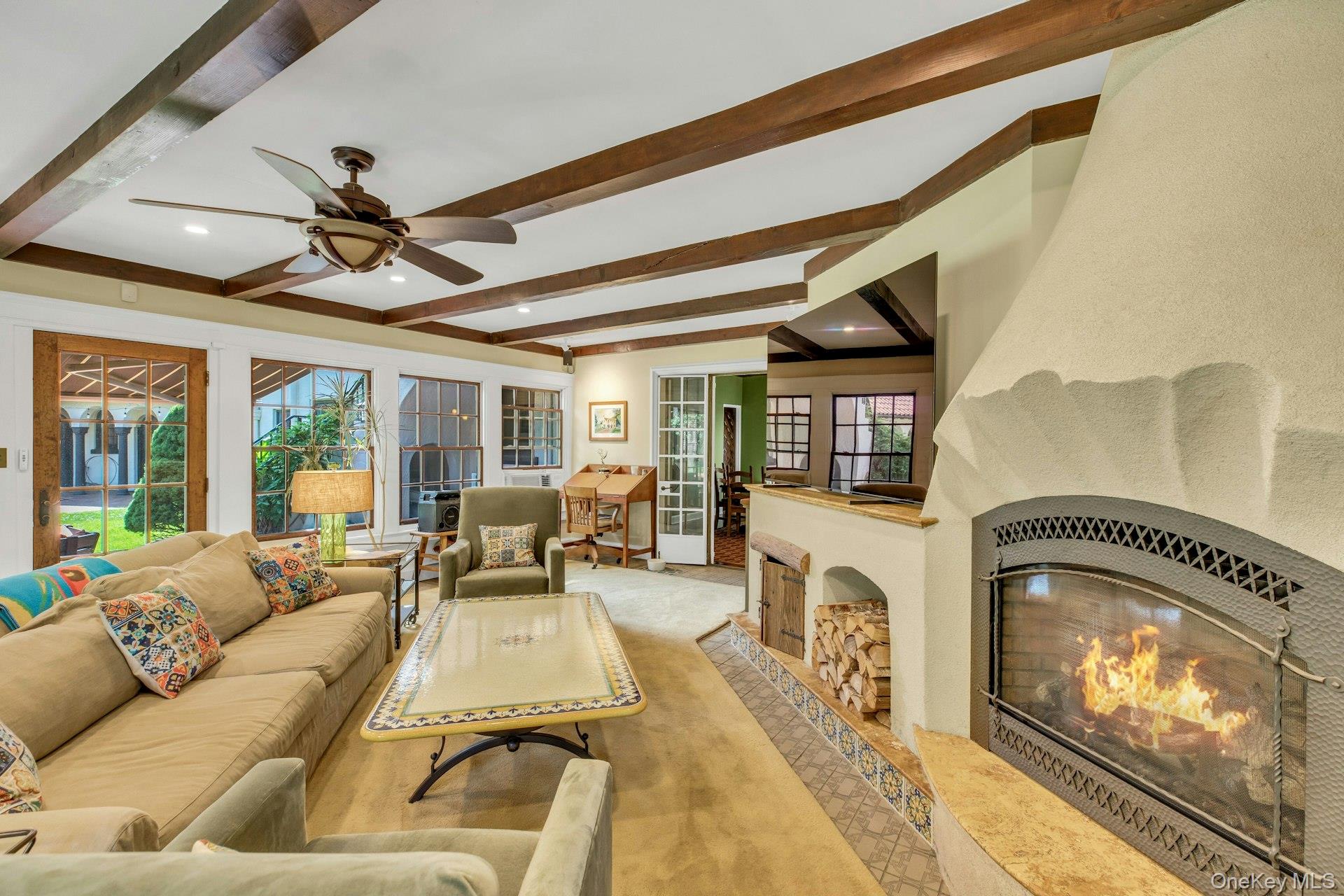 259 Lakeview Avenue West Brightwaters, NY 11718 - Photo 23 of 49 a living room with fireplace furniture and a floor to ceiling window