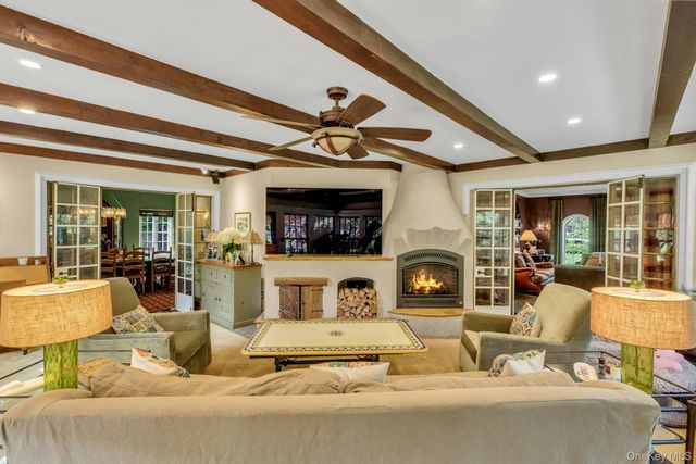 a living room with fireplace furniture and a fireplace