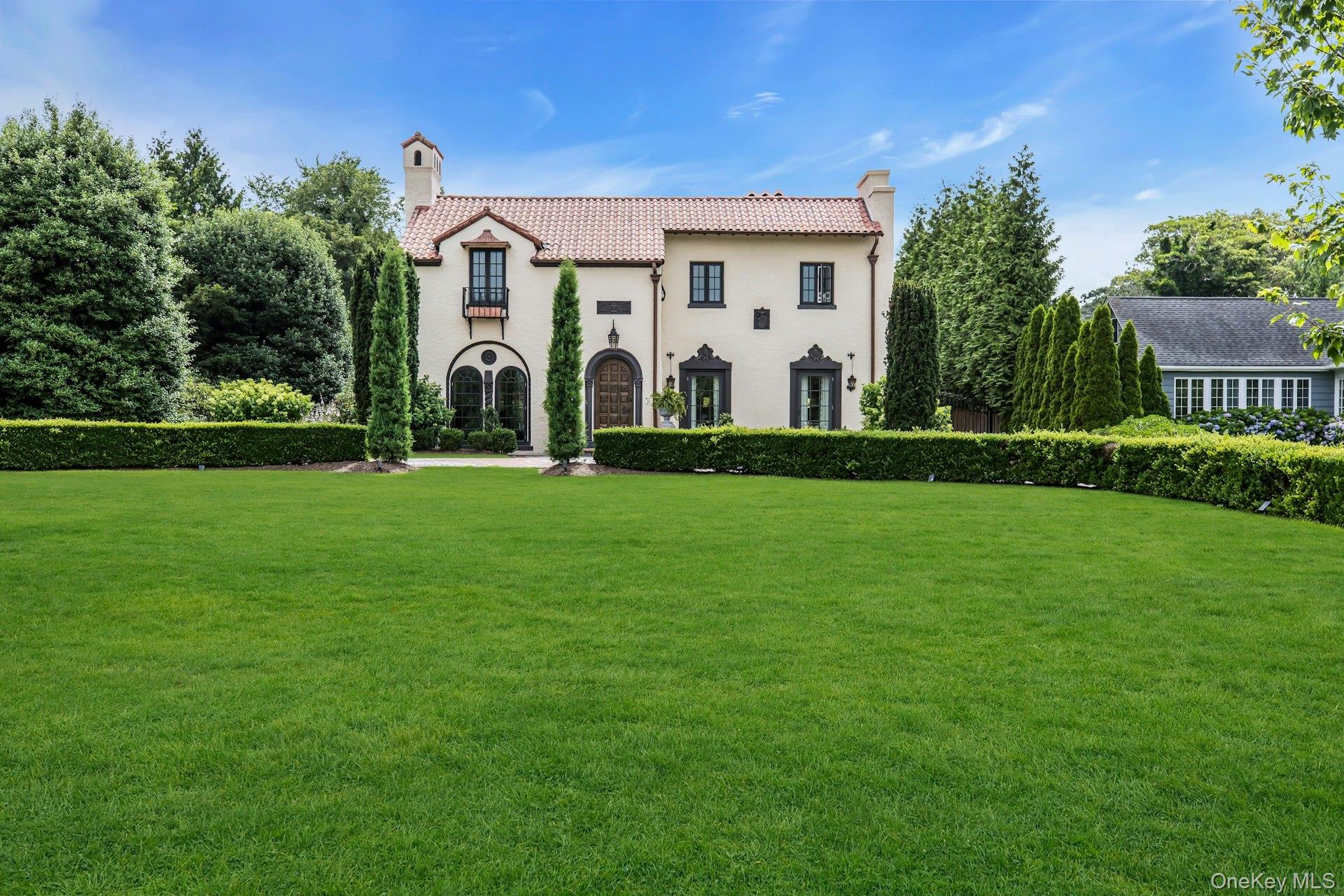 259 Lakeview Avenue West Brightwaters, NY 11718 - Photo 3 of 49 a front view of a house with garden