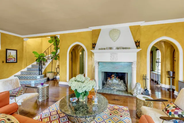 a living room with furniture and a fireplace