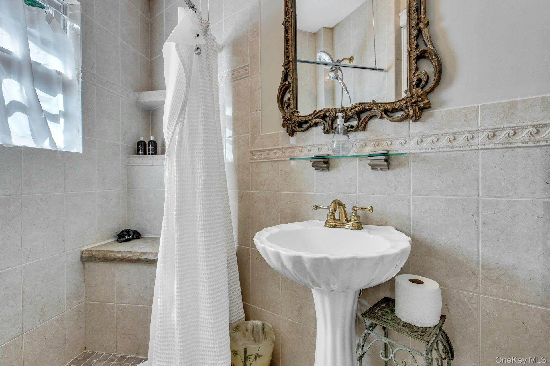 259 Lakeview Avenue West Brightwaters, NY 11718 - Photo 36 of 49 a bathroom with a sink toilet and mirror
