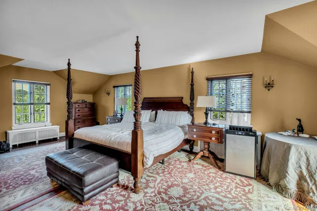 a bedroom with furniture and a window