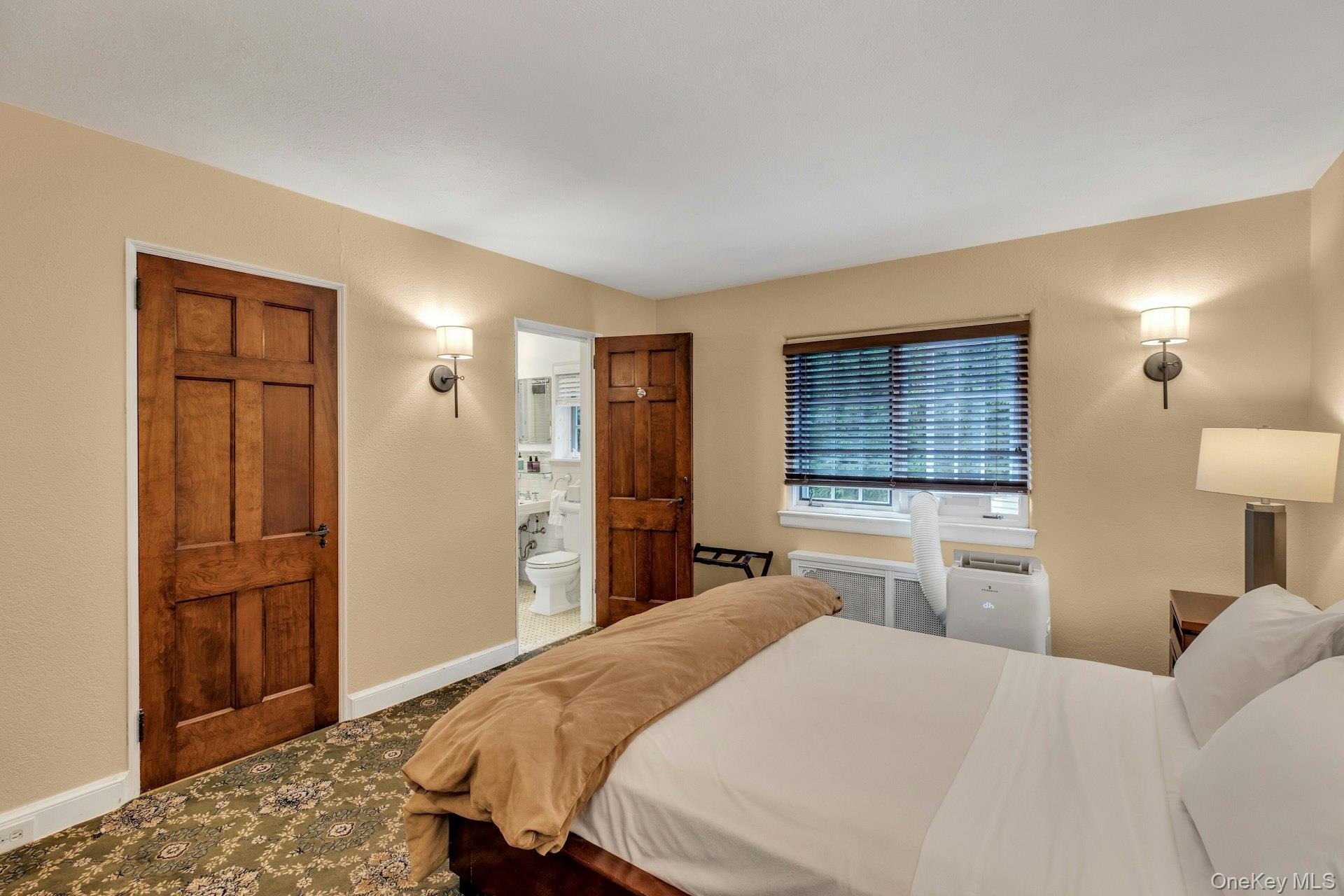 259 Lakeview Avenue West Brightwaters, NY 11718 - Photo 42 of 49 a bedroom with a bed and a dresser in it
