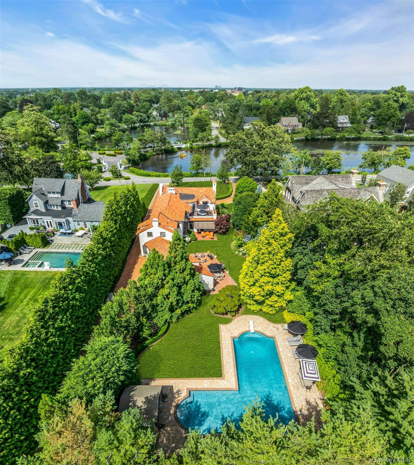 259 Lakeview Avenue West Brightwaters, NY 11718 - Photo 8 of 49 an aerial view of residential houses with outdoor space and trees all around