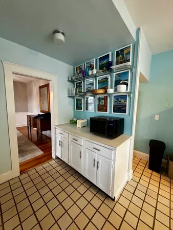 a kitchen with refrigerator and window