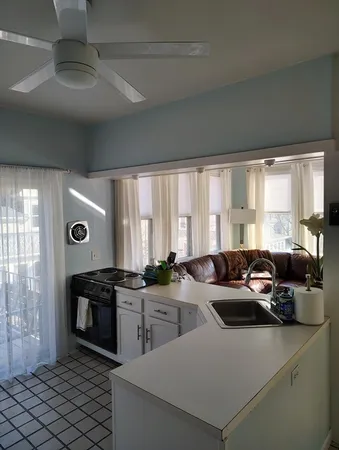 a view of a dining room with furniture and window