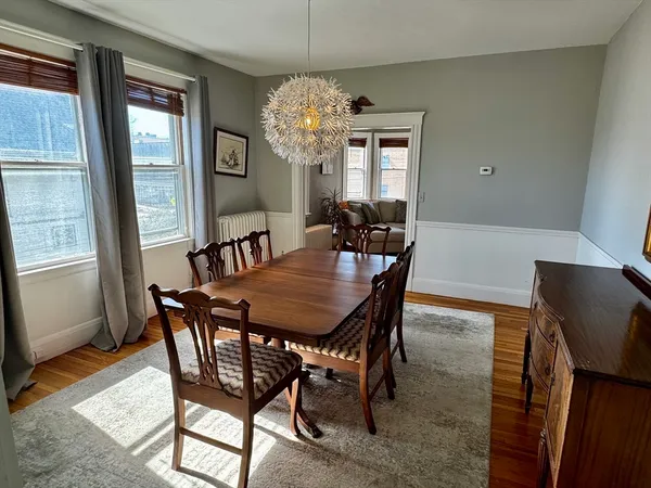a bathroom with a sink a toilet and a window