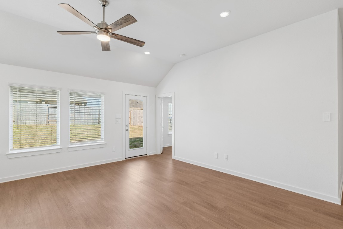 707 Hackberry Branch Magnolia, TX 77354 - Photo 11 of 50 an empty room with wooden floor fan and windows
