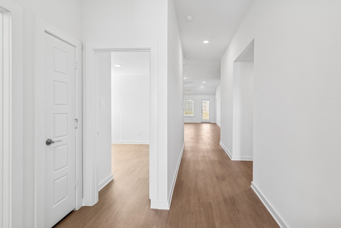 707 Hackberry Branch Magnolia, TX 77354 - Photo 20 of 50 a view of a hallway with wooden floor
