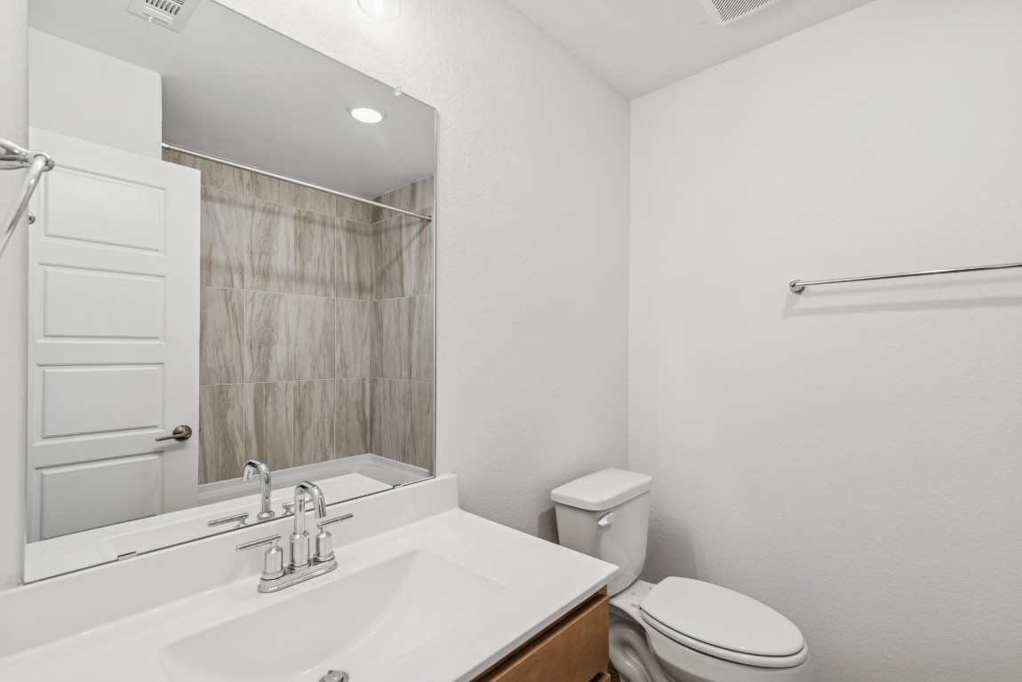 707 Hackberry Branch Magnolia, TX 77354 - Photo 28 of 50 a bathroom with a sink a toilet and shower