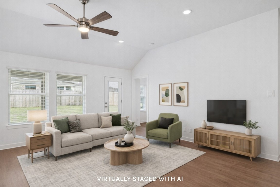 707 Hackberry Branch Magnolia, TX 77354 - Photo 3 of 50 a living room with furniture and a flat screen tv