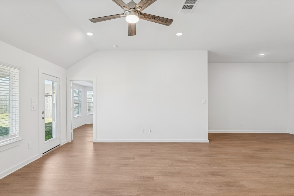 707 Hackberry Branch Magnolia, TX 77354 - Photo 34 of 50 an empty room with wooden floor and windows