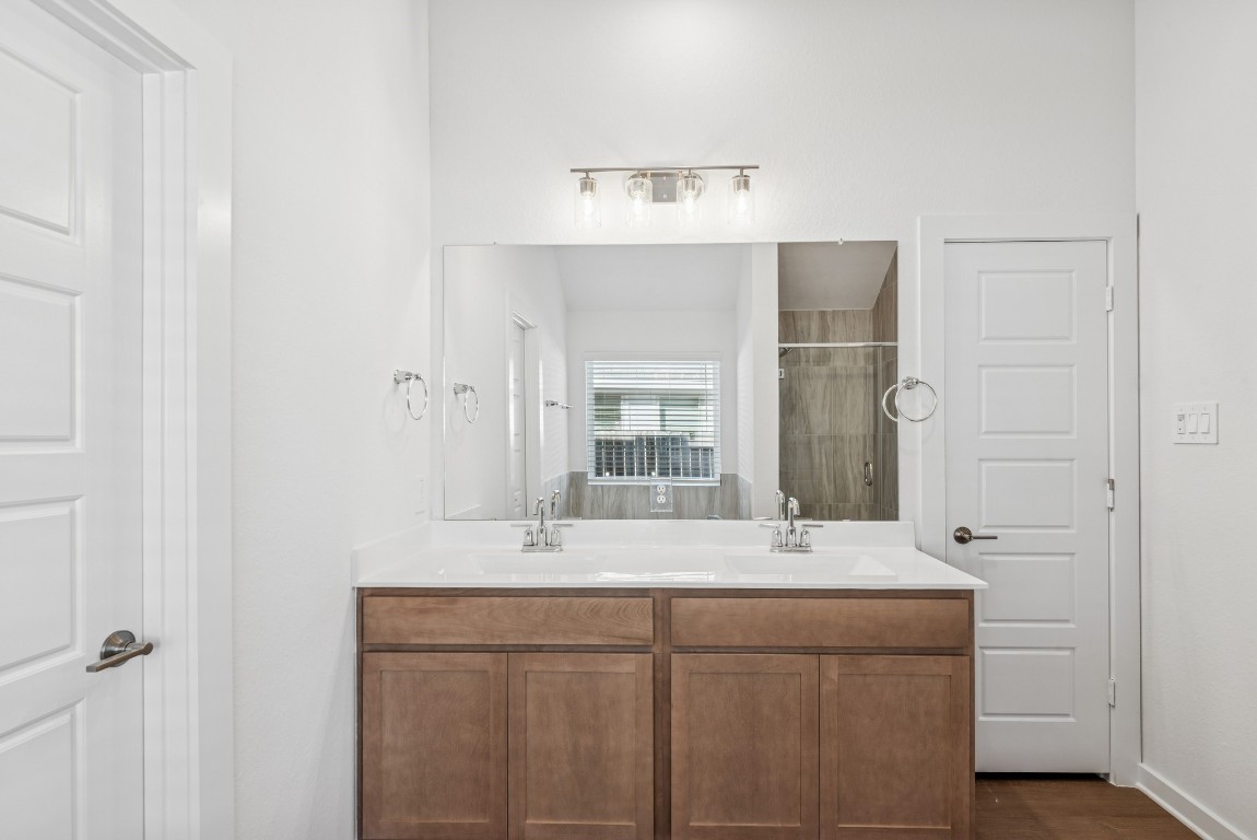 707 Hackberry Branch Magnolia, TX 77354 - Photo 38 of 50 a bathroom with a sink and a mirror