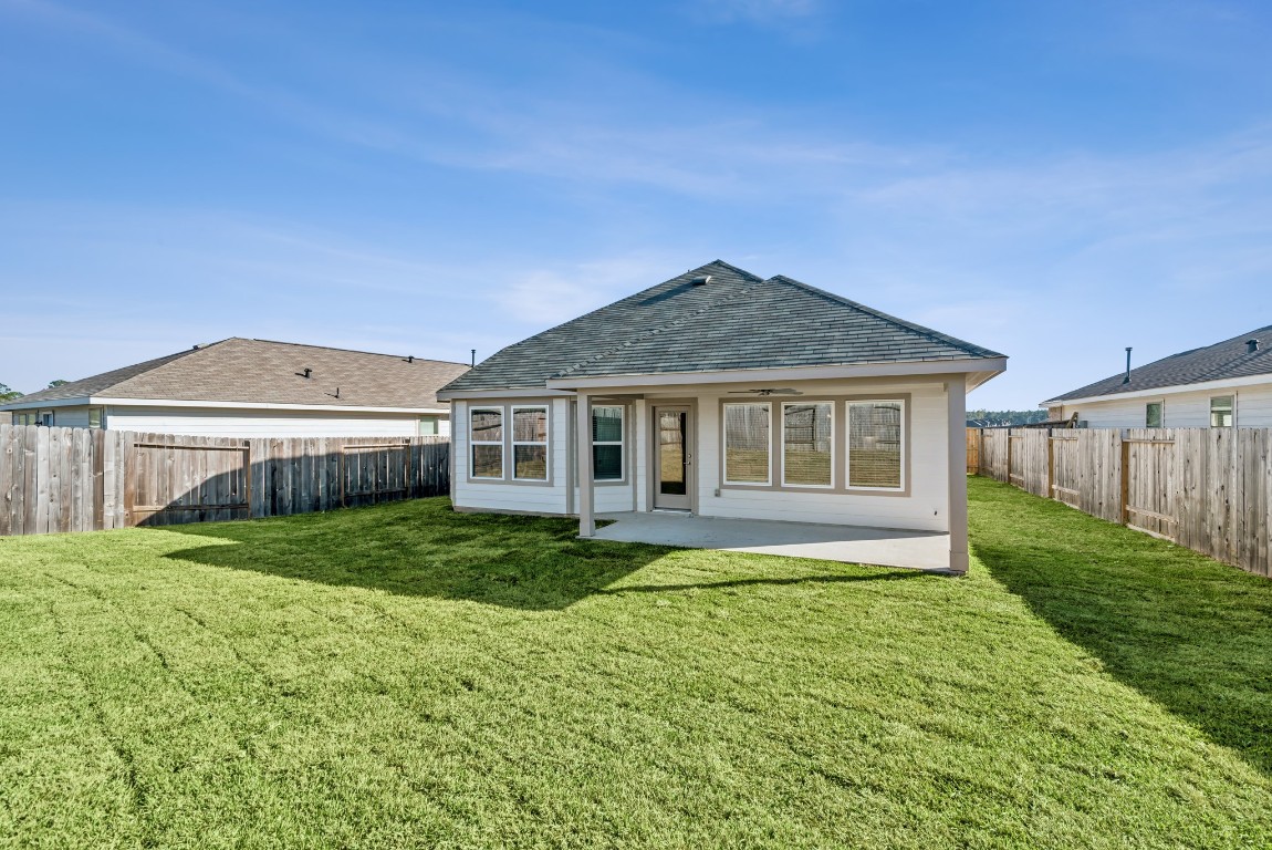 707 Hackberry Branch Magnolia, TX 77354 - Photo 45 of 50 a house that is sitting in the grass