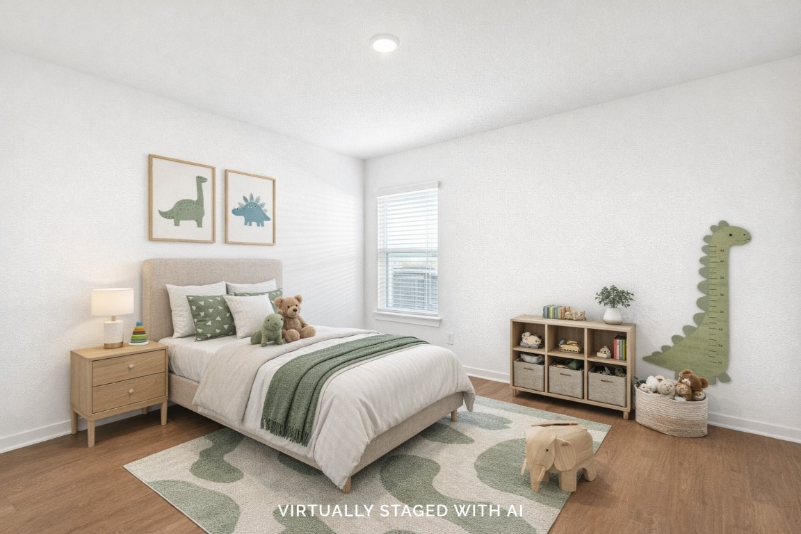 707 Hackberry Branch Magnolia, TX 77354 - Photo 6 of 50 a bedroom with a bed and a couch