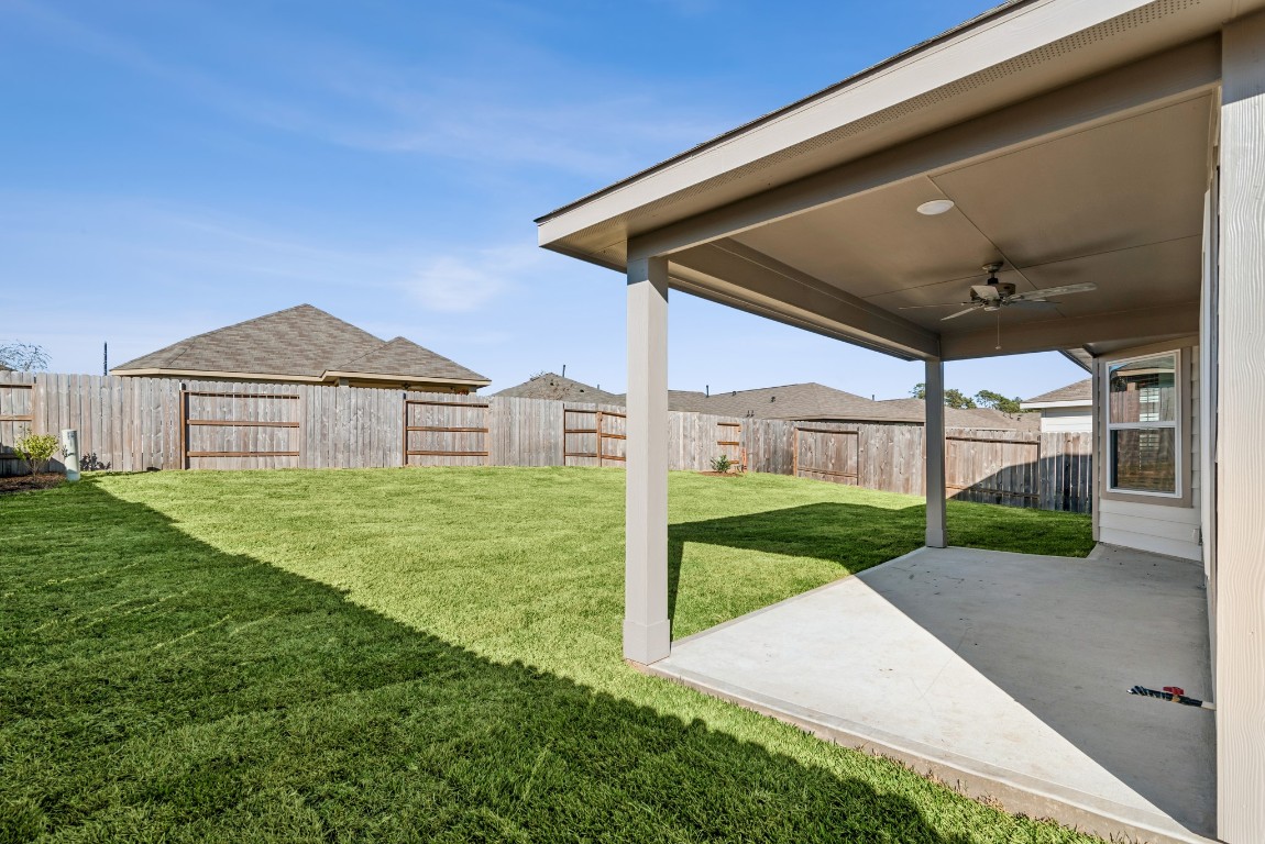 707 Hackberry Branch Magnolia, TX 77354 - Photo 9 of 50 a view of a back yard of the house