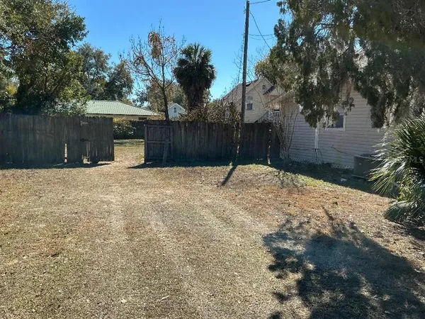 a street view covered with wooden fence