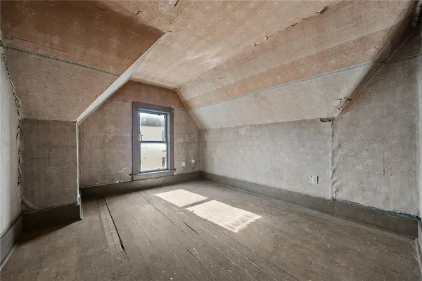 a view of an empty room with a garage