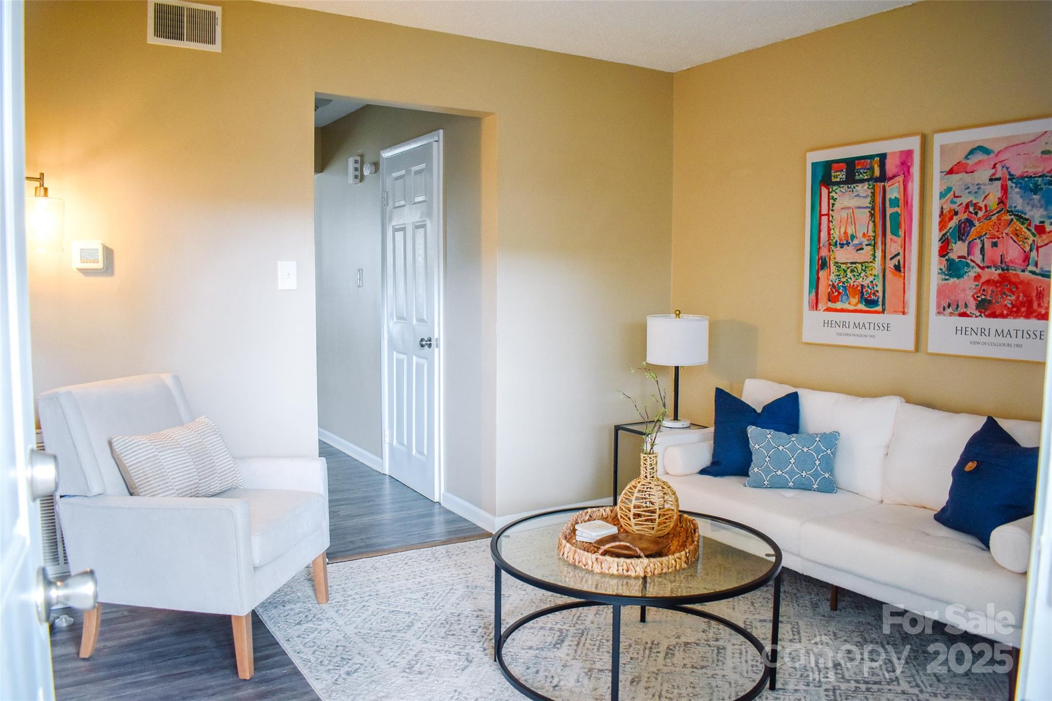 7526 Holly Grove Court Charlotte, NC 28227 - Photo 28 of 42 a living room with furniture and a wooden floor