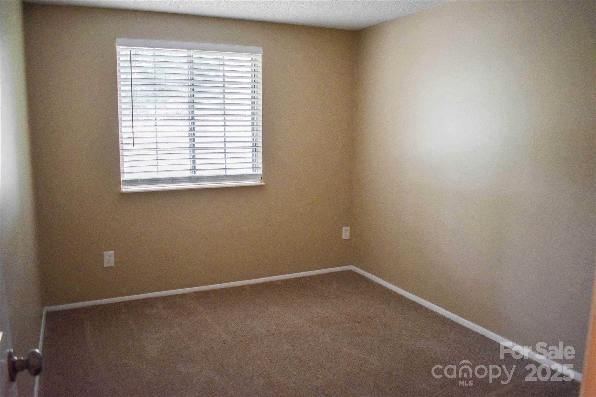 7526 Holly Grove Court Charlotte, NC 28227 - Photo 35 of 42 an empty room with a window