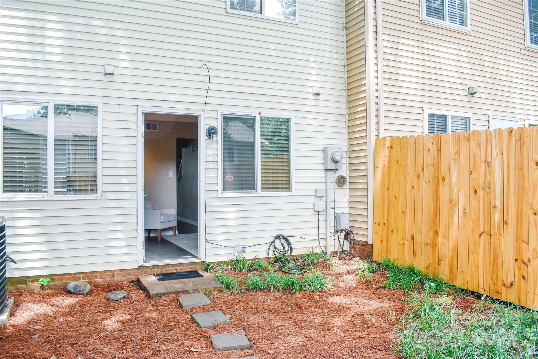 7526 Holly Grove Court Charlotte, NC 28227 - Photo 40 of 42 a front view of a house with garden