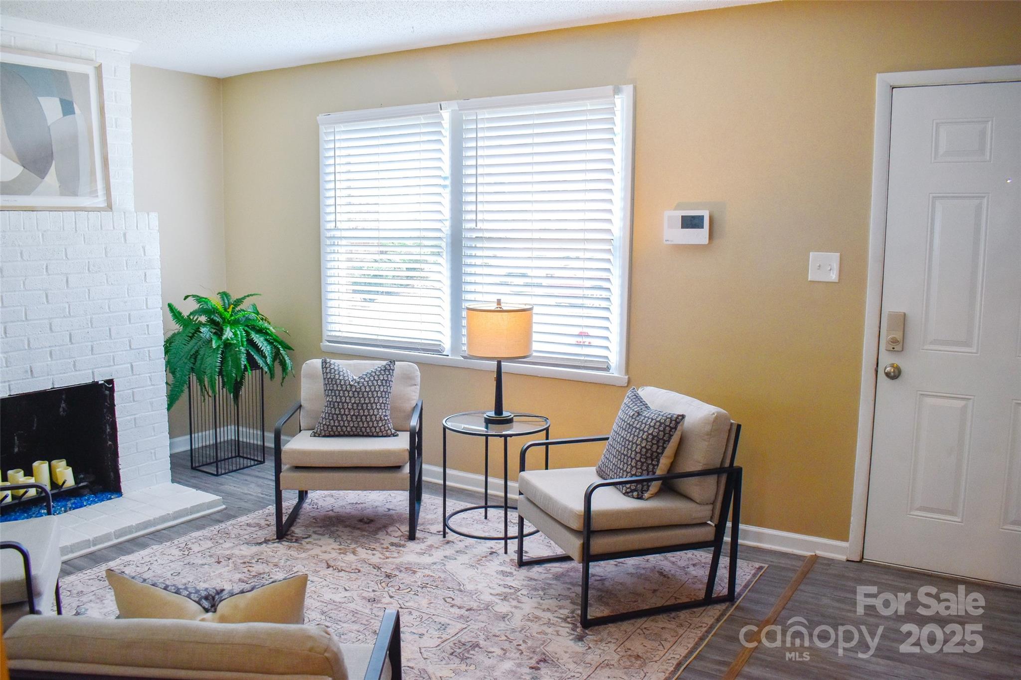 7526 Holly Grove Court Charlotte, NC 28227 - Photo 4 of 42 a living room with furniture and a potted plant