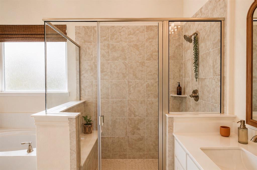 1530 County Road 200 Valley View, TX 76272 - Photo 23 of 34 Tiled walk-in shower with glass enclosure, featuring a built-in shelf and bronze-finish fixtures