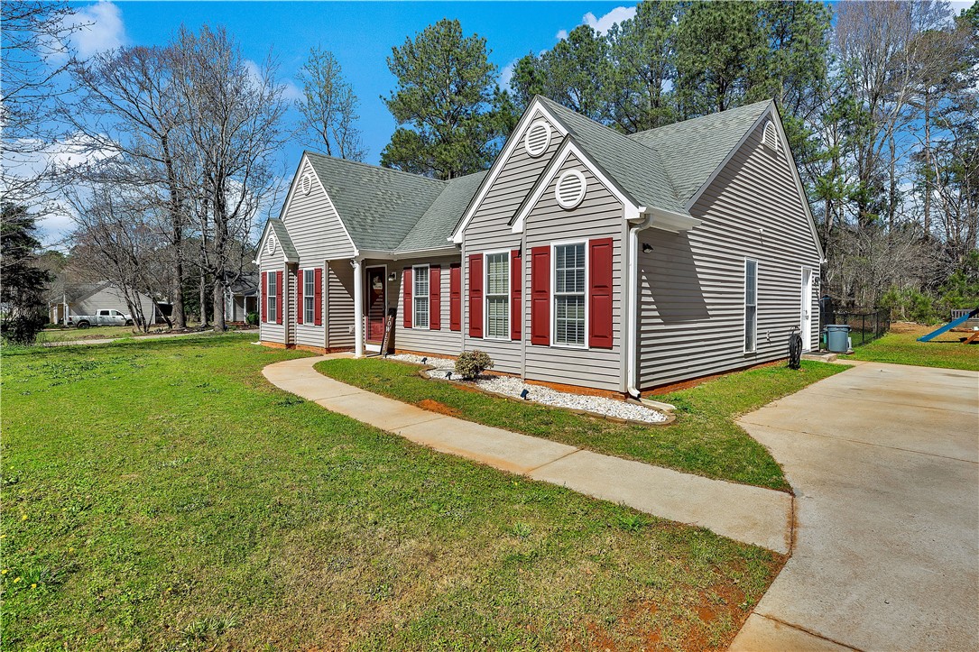 3338 Centerville Road Anderson, SC 29625 - Photo 3 of 28 This charming residence features appealing architectural details, including an inviting pathway and well-maintained grounds.