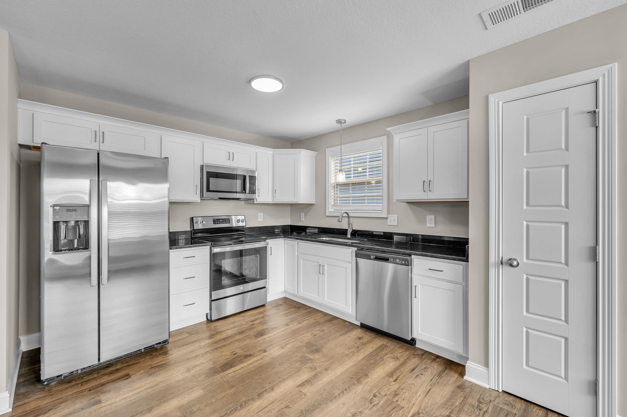 631 Avondale Road Oak Grove, KY 42262 - Photo 13 of 48 a kitchen with cabinets stainless steel appliances and a window