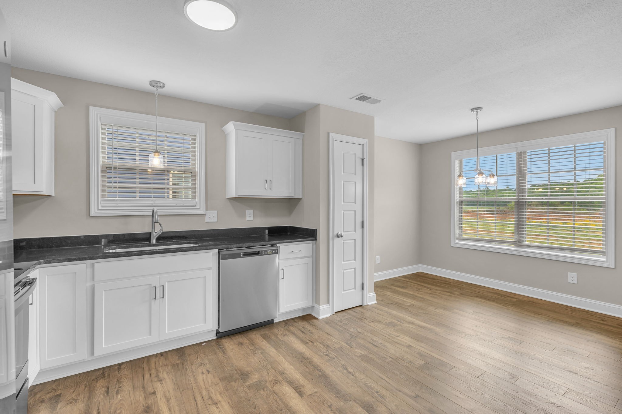 631 Avondale Road Oak Grove, KY 42262 - Photo 14 of 48 a kitchen with granite countertop a sink window and cabinets