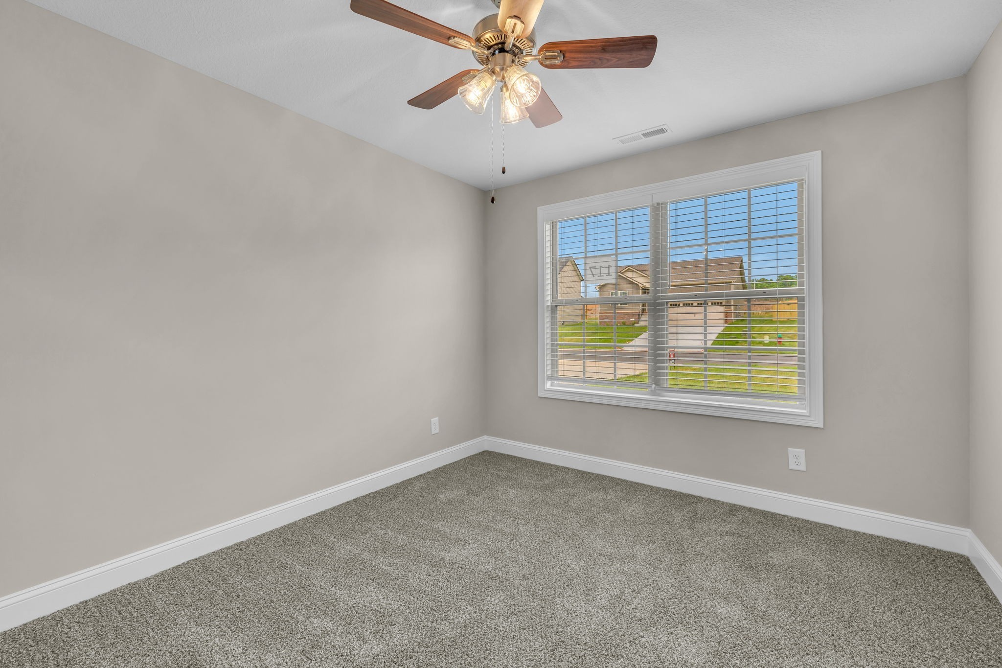 631 Avondale Road Oak Grove, KY 42262 - Photo 17 of 48 a view of an empty room with window and chandelier fan