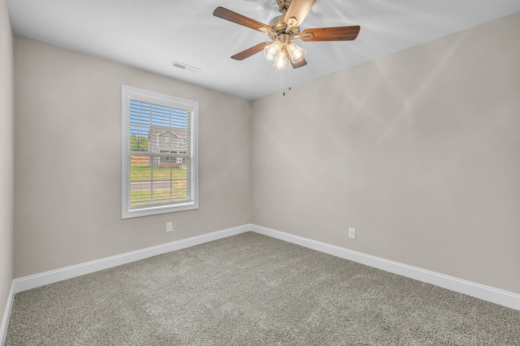 631 Avondale Road Oak Grove, KY 42262 - Photo 20 of 48 an empty room with a window and a fan