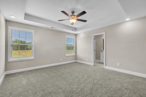 a bathroom with a glass shower door and a mirror