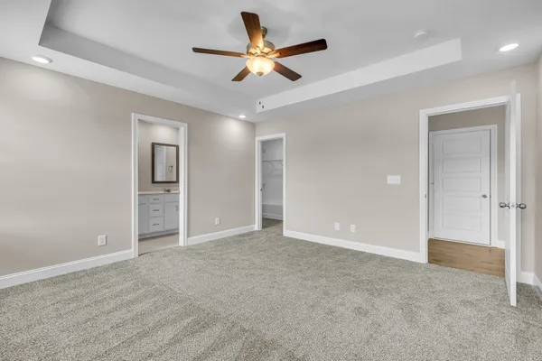 a white toilet sitting next to a shower