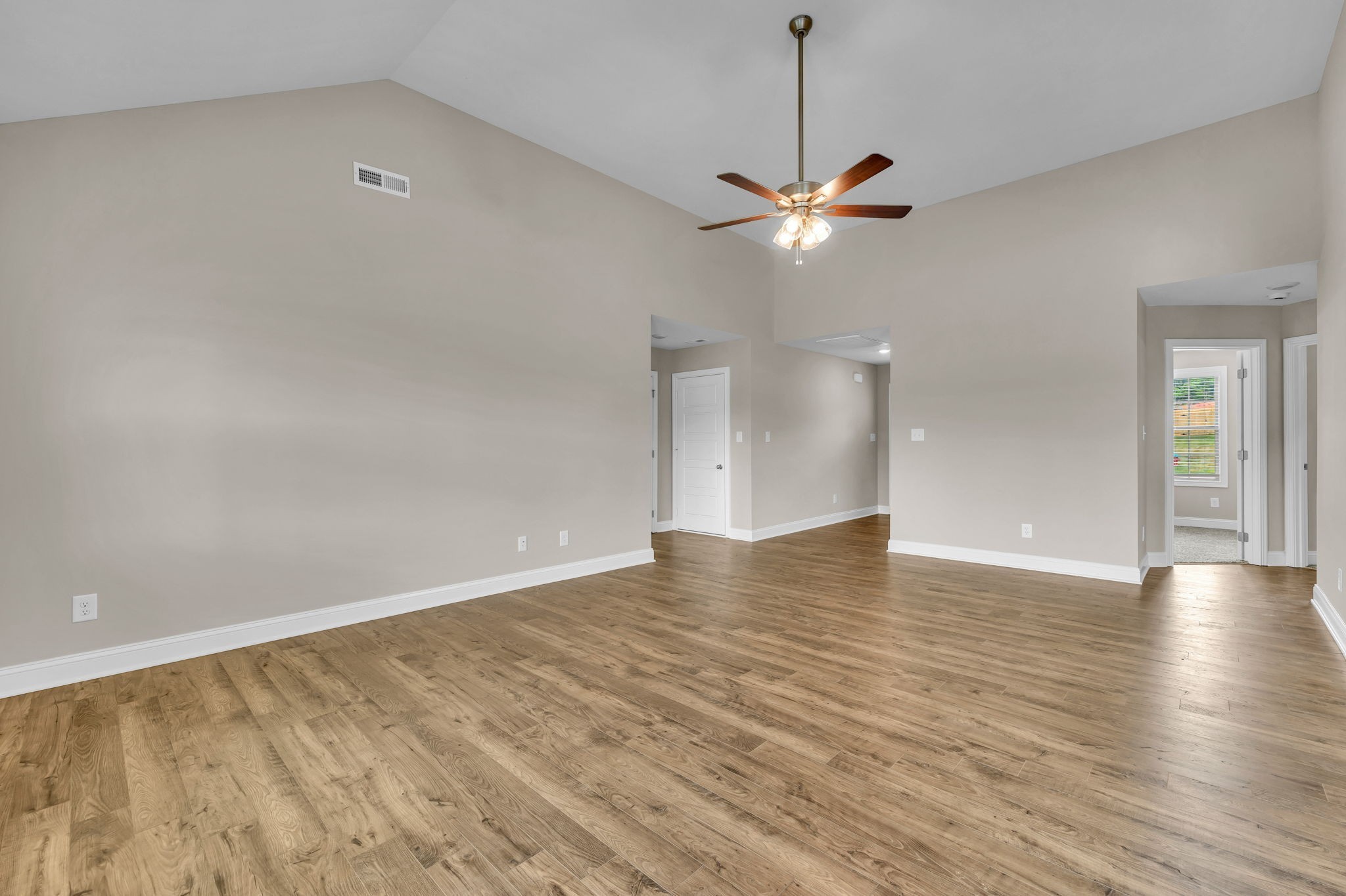 631 Avondale Road Oak Grove, KY 42262 - Photo 8 of 48 a view of an empty room with a ceiling fan and wooden floor