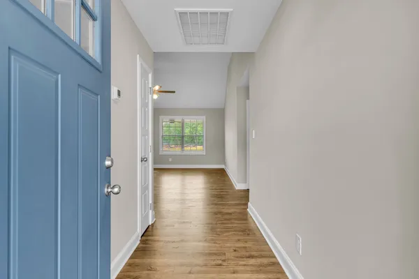 a kitchen with cabinets stainless steel appliances and a window