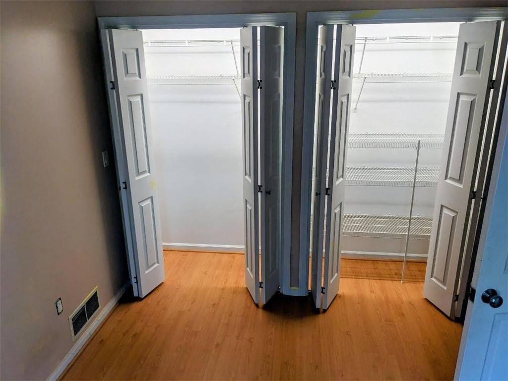 80 Genesee View Trail Chili, NY 14623 - Photo 9 of 21 second bedroom wall of closets