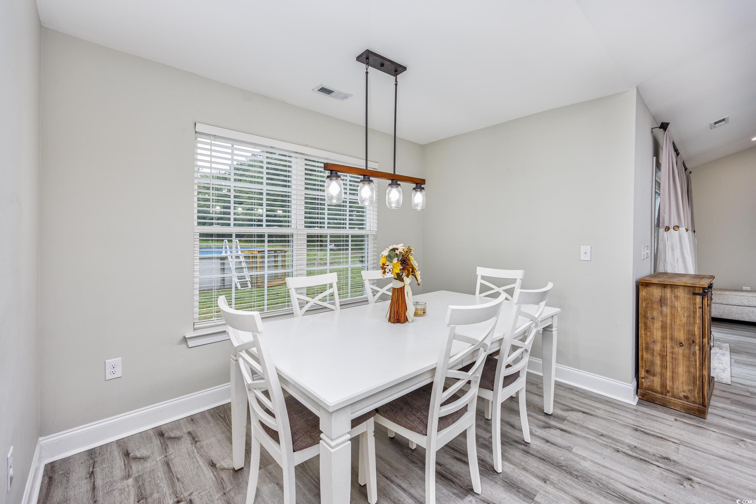 2900 Cherry Hill Road Loris, SC 29569 - Photo 11 of 34 Dining space with wood finished floors, visible ve
