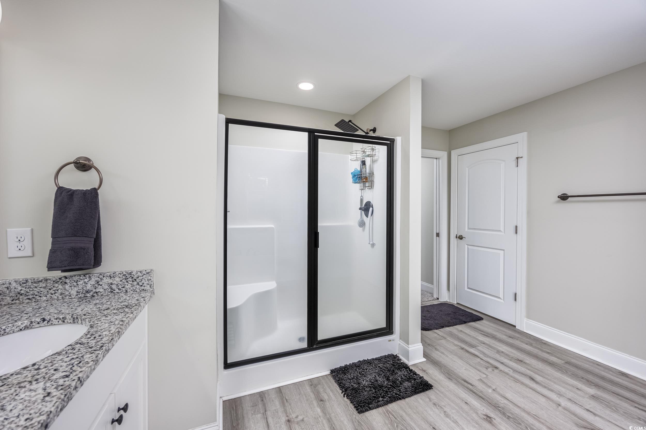 2900 Cherry Hill Road Loris, SC 29569 - Photo 15 of 34 Bathroom with a stall shower, vanity, baseboards,